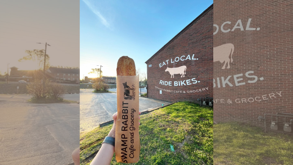 A loaf of bread in a Swamp Rabbit Cafe and Grocery Bag up agains the "Eat Local, Ride Bikes" wall.
