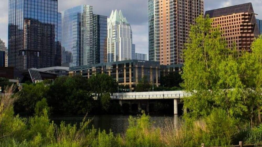 A cyclist on the trail near downtown Austin