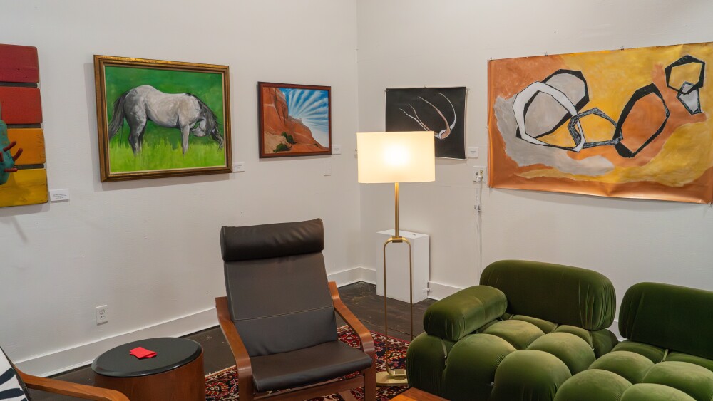 The Agarita Loft with hanging artwork and midcentury modern furniture.