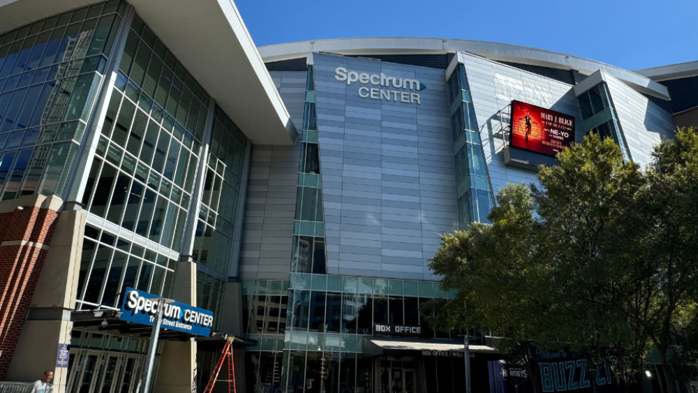 An exterior shot of the Spectrum Center in Uptown on a clear day.