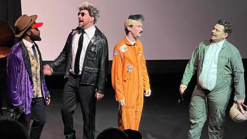 Photo of comedians on stage.