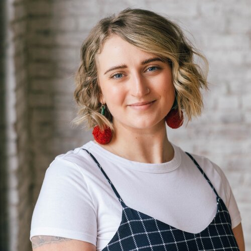 Katie Molck in a yellow sweater