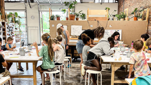 Kids in a pottery class.