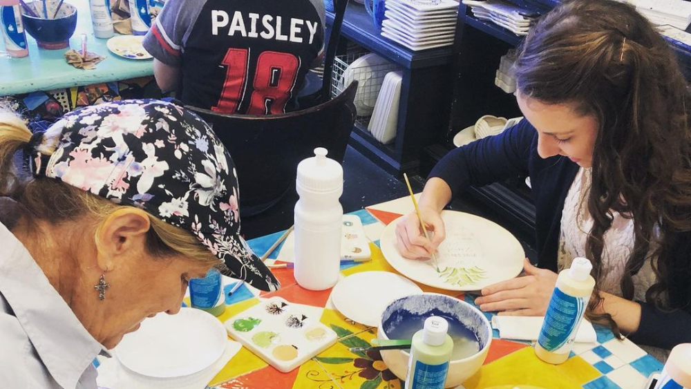 Two women painting