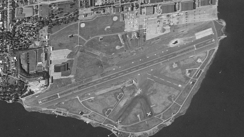 A black and white overhead view of Sand Point Naval Station circa 1964.