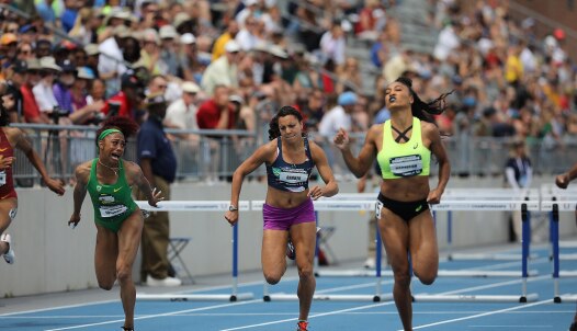 Three women at the end of a 400m hurdles track race