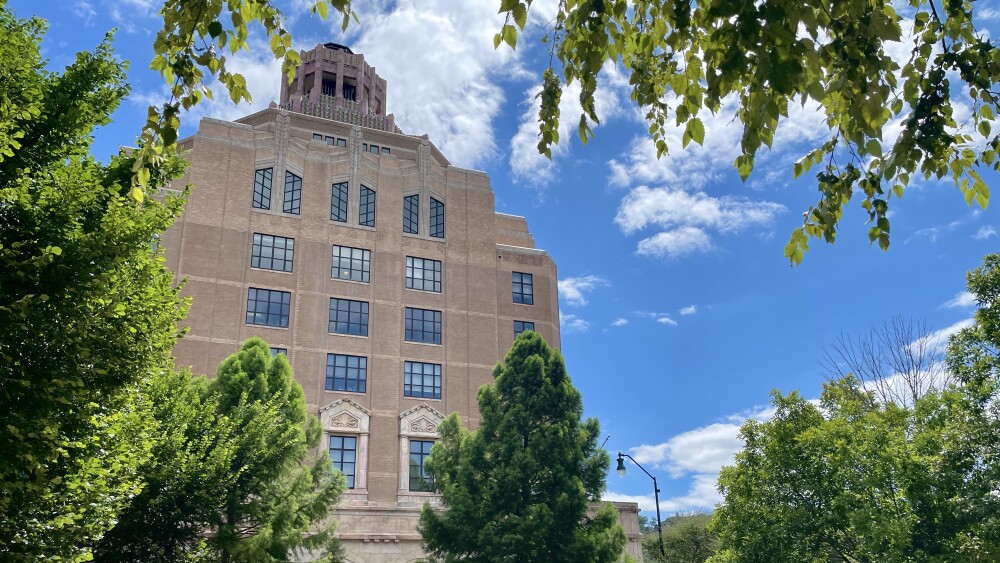 the front of asheville city hall with trees