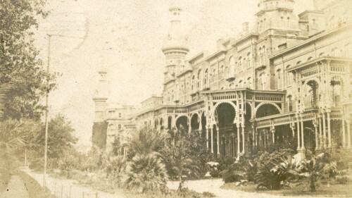 An old photo of the Tampa Bay Hotel, now known as the Henry B Plant Museum. Its iconic silver minarets sit above intricate architecture.
