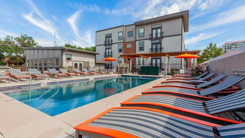 Pictured is the outdoor pool surrounded by lounge chairs.