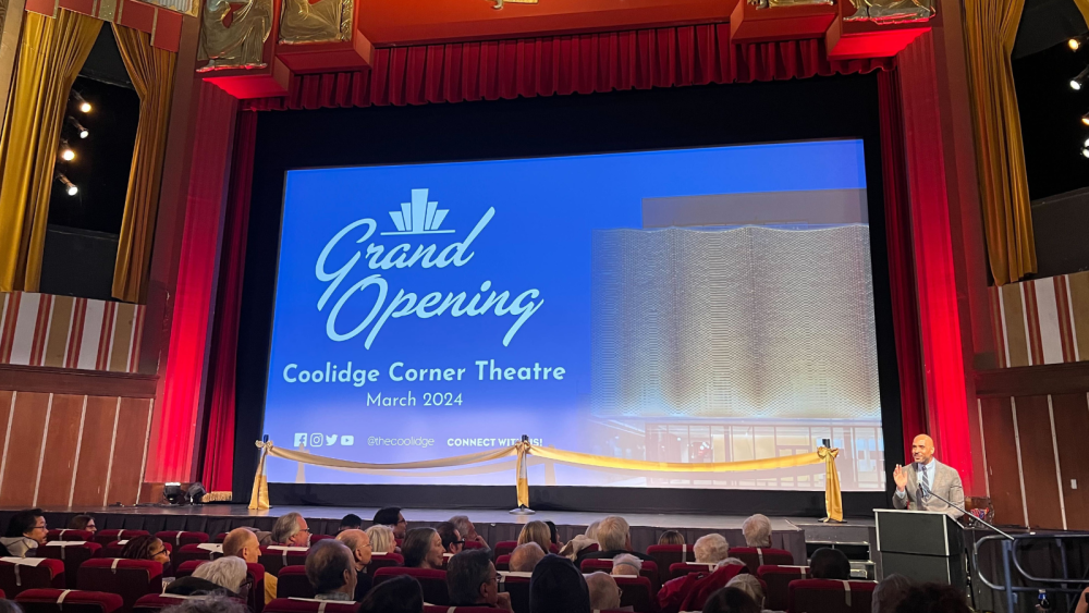 Coolidge Corner Theatre grand opening ceremony with speaker at podium.