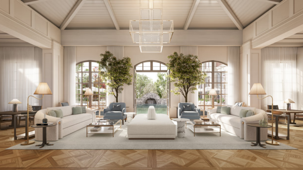 A rendering of the interior of a unit. The view shows what looks to be a living room space situated in front of the three window panes with hardwood floors, two white couches facing one another, a white ottoman between them, two glass coffee tables, four floor lamps, and two blue chairs.