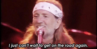 A gif of Willie Nelson singing "On the Road Again"