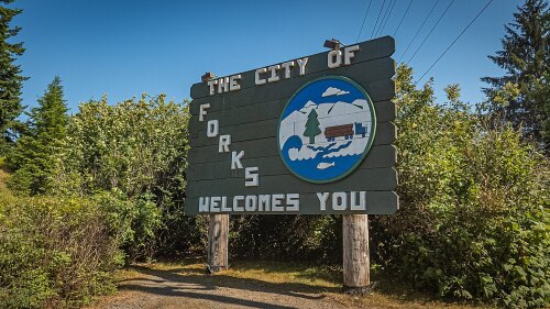 A sign that reads "The city of Forks welcomes you"
