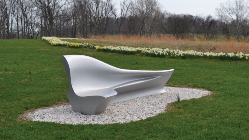 A large outdoor sculpture of a bench constructed by Zaha Hadid.