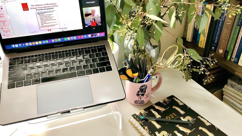 Photo of a desk setup with the Red Hot Mamas online education program pulled up on the laptop.