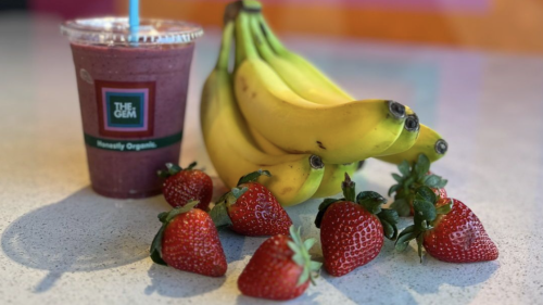 Purple juice pictured with fruits at Gem Juice spot.