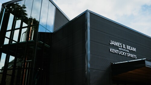 A metal building with big glass windows