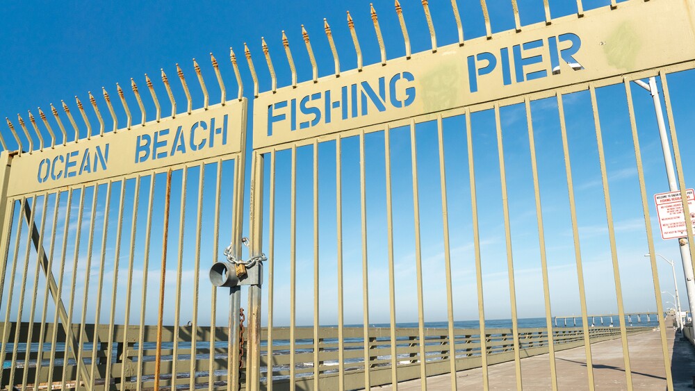 The gate leading to the entrance of the OB Pier in Ocean Beach