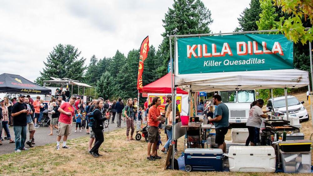People line up at food vendor booths at the PDX Adult Soapbox Derby in 2019.