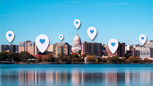 A skyline photo of Madison with social media hearts peppering the sky.png
