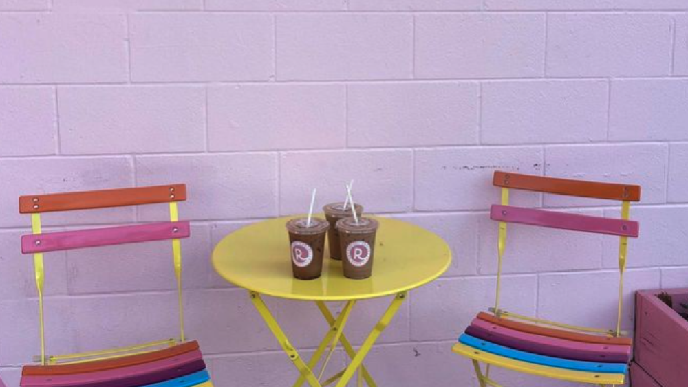 Coffees on a rainbow outdoor table.