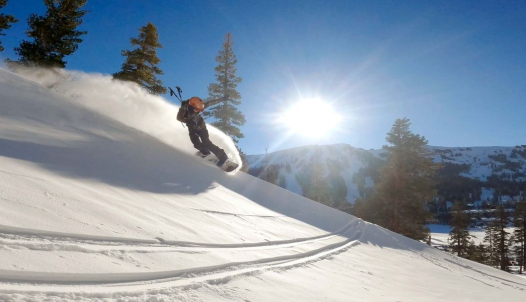 A snowboarder goes down a slope at Kirkwood