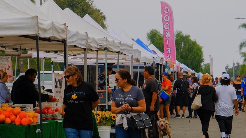 People browsing vendors at the Third Avenue Market in Chula Vista