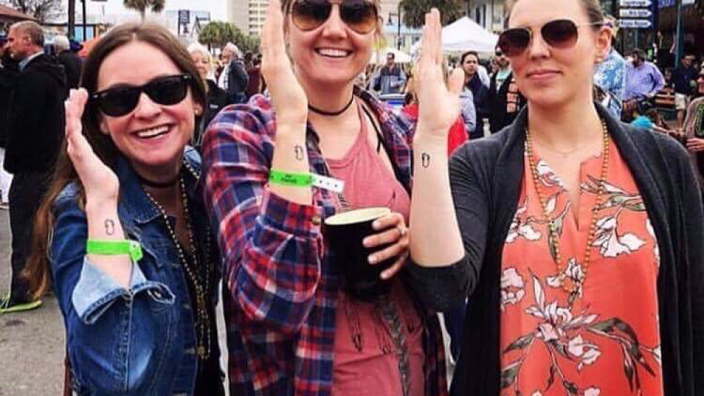 pineapple tattoo on woman's arm