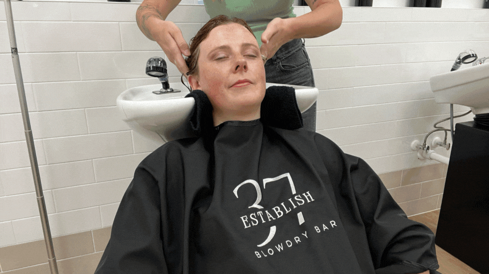 Shots of City Editor Connor getting her hair shampooed and styled at Establish 37.