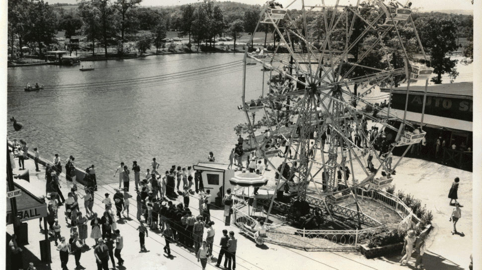 A gif of 8 vintage black and white photos of people playing in a lake, amusement park rides, and a couple riding a rollercoaster.