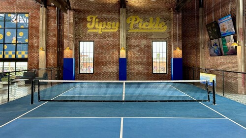 A vacant pickleball court inside Tipsy Pickle.