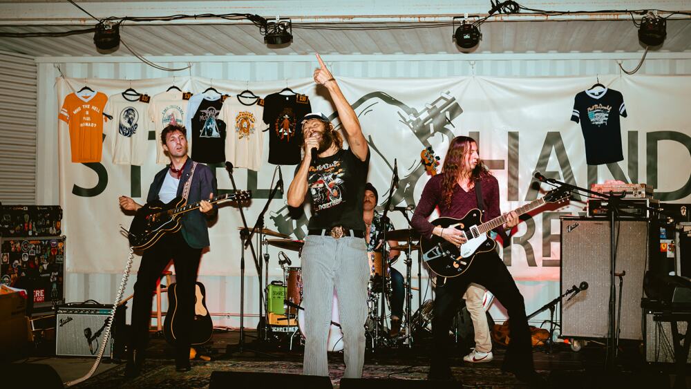 An artist on stage while the crowd enjoys a performance during the Nashville Nights summer concert series at Steel Hands Brewing.