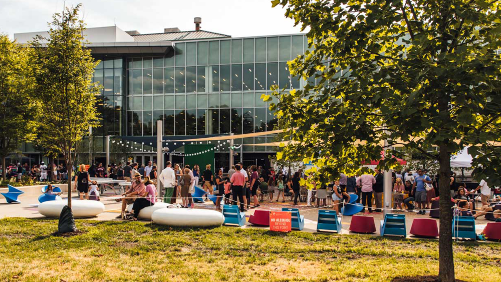 people enjoying Kaufman plaza behind the Columbus Metropolitan Library's Main Library