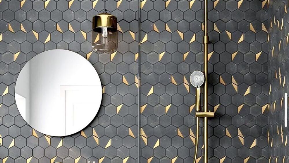 a black and gold tile backsplash in a bathroom