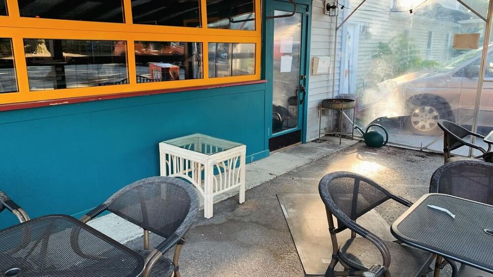 Sparse patio after a thief stole furniture, decor, etc.
