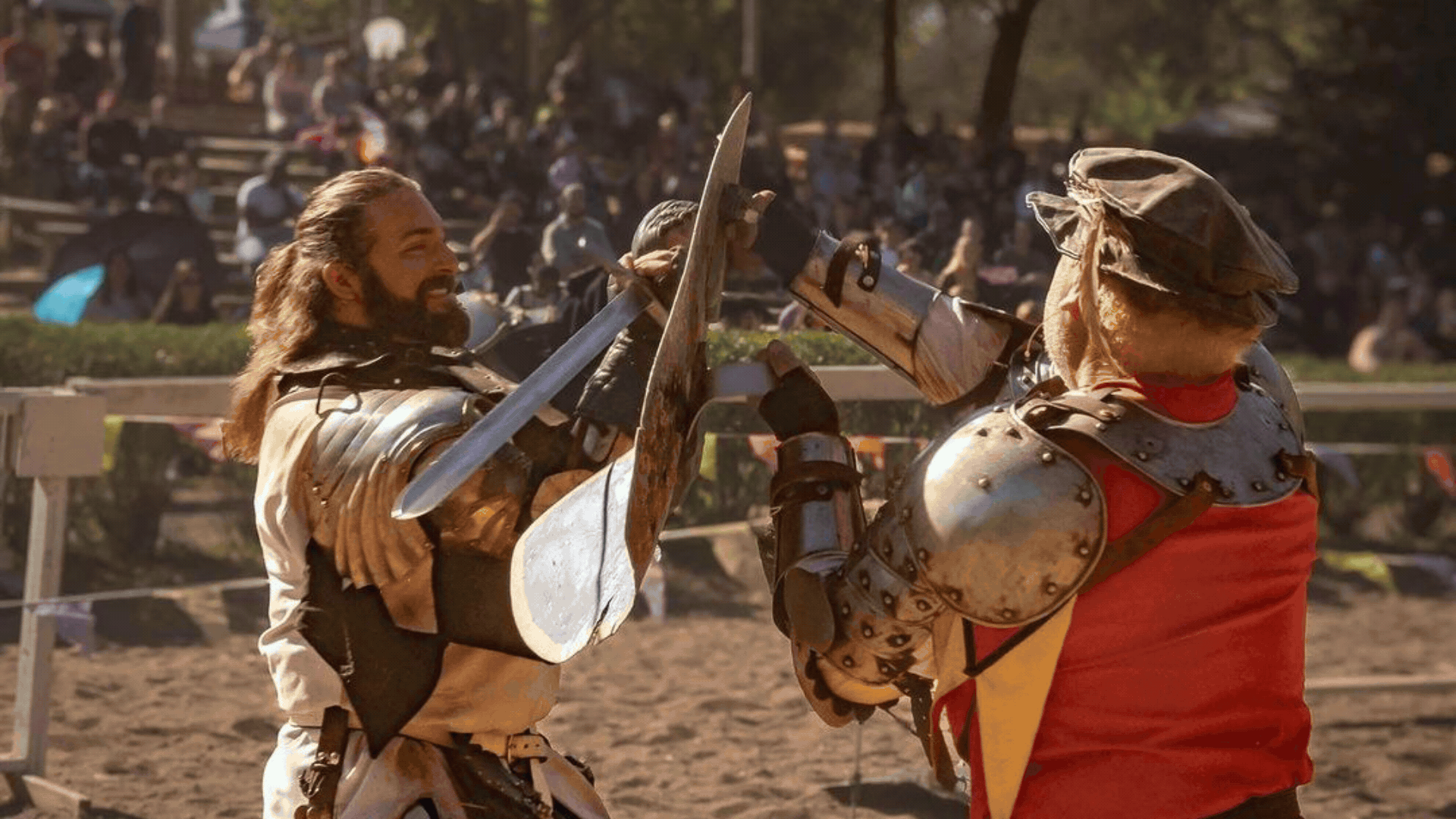 Renaissance Fest and Irish fest pictures show one after each other. the first is of two men jousting. the second is a crowd shot showing people walking on the street at KC Irish test underneath a pedestrian bridge.