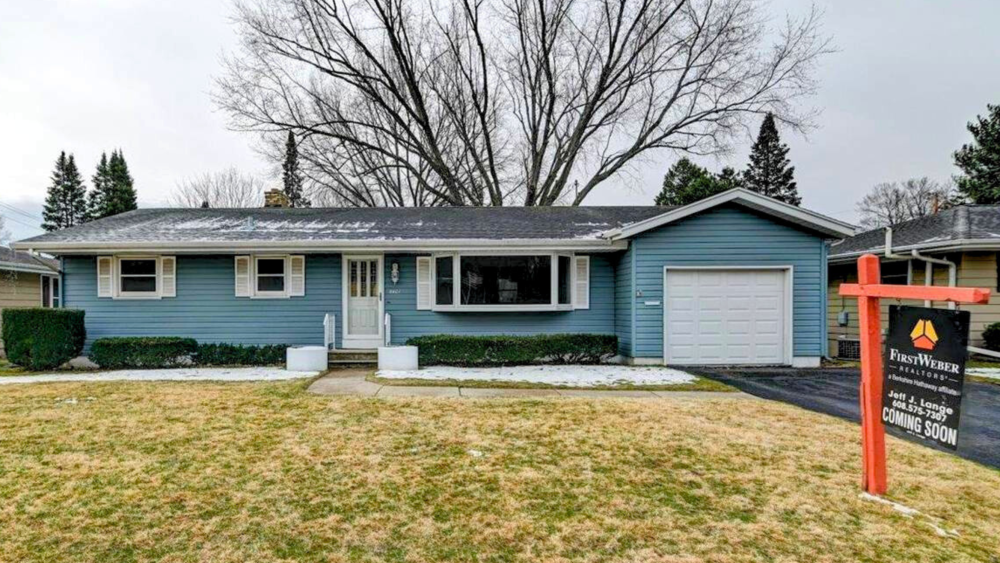 5401 Painted Post Drive, a blue ranch-style home