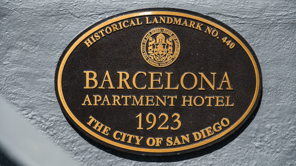 A close-up an official bronze plaque marking The Barcelona Historical Landmark No. 440 in San Diego.