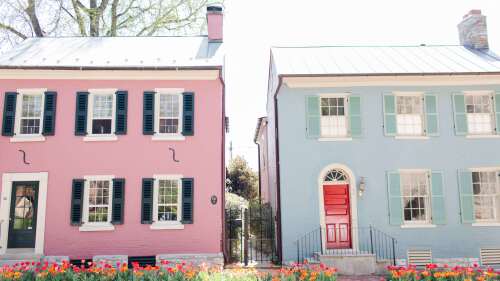 A historic pink home and blue home sit side by side near Gratz Park in Lexington.