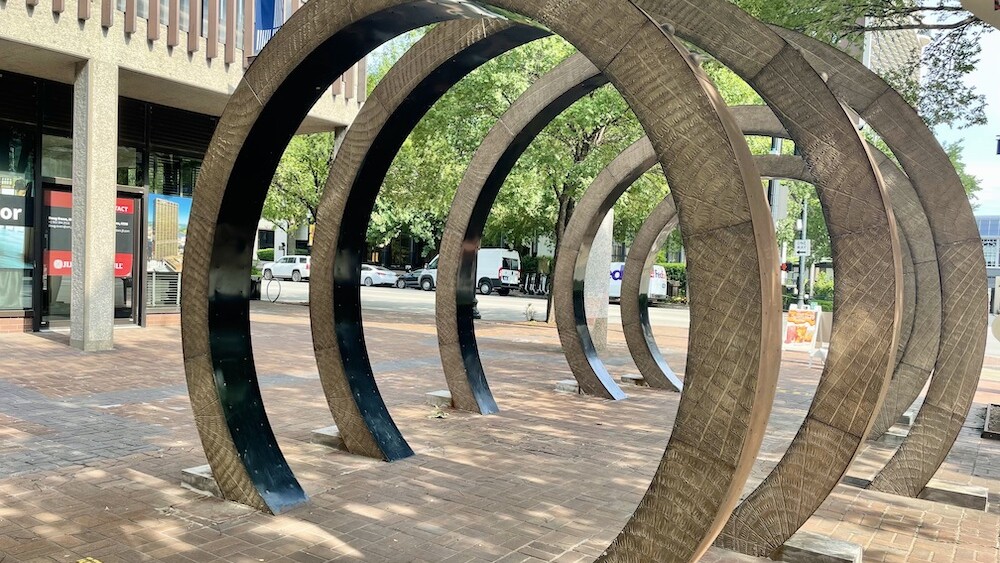Five aluminum rings painted to look like wood represent a bourbon barrel.
