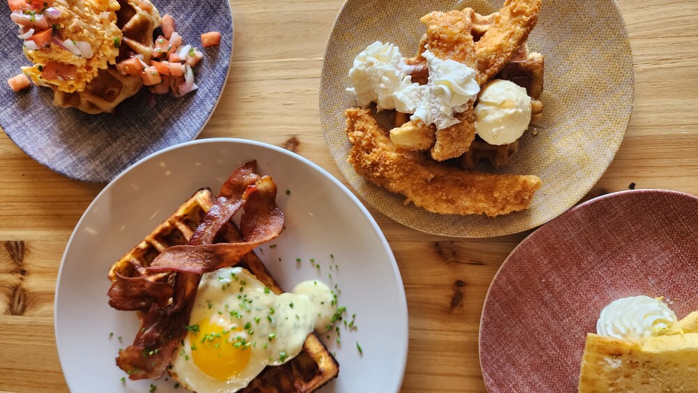 flat lay shot of plates of brunch food