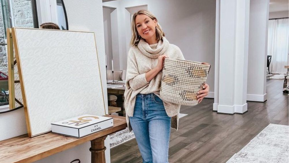 Austin-based influencer Lee Ann Benjamin poses with a basket in her home.