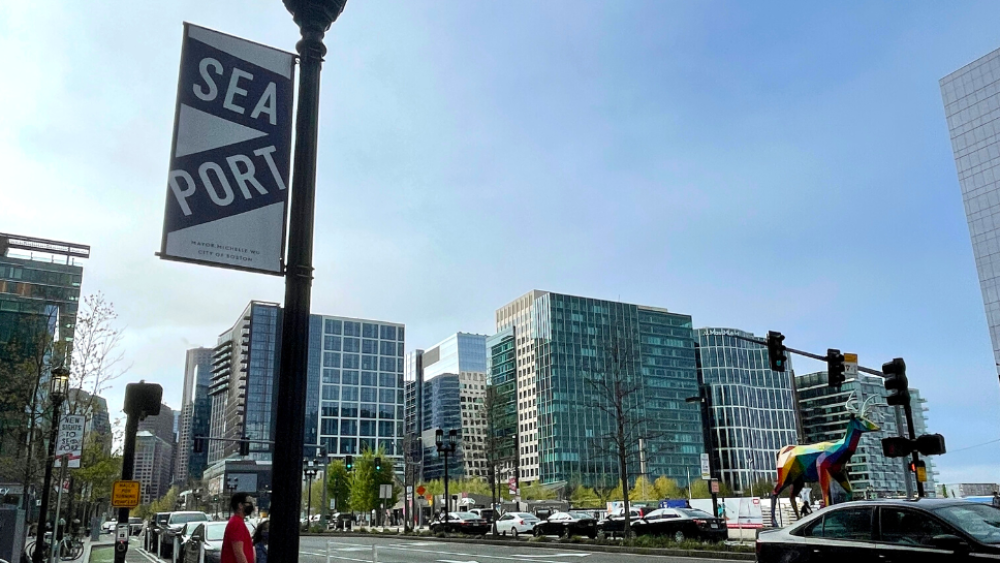 "Seaport" sign in front of buildings