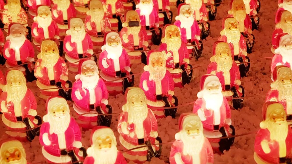 An army of illuminated plastic Santa figures