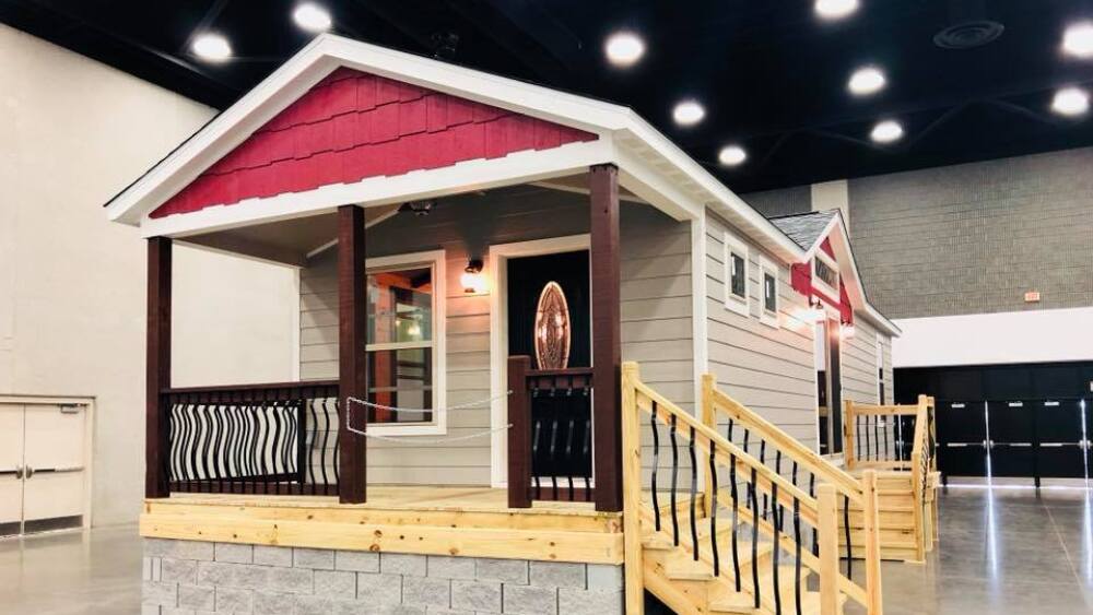 fully constructed cabin in a warehouse