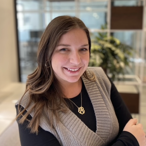Jess Burton in a blue shirt and gold necklace