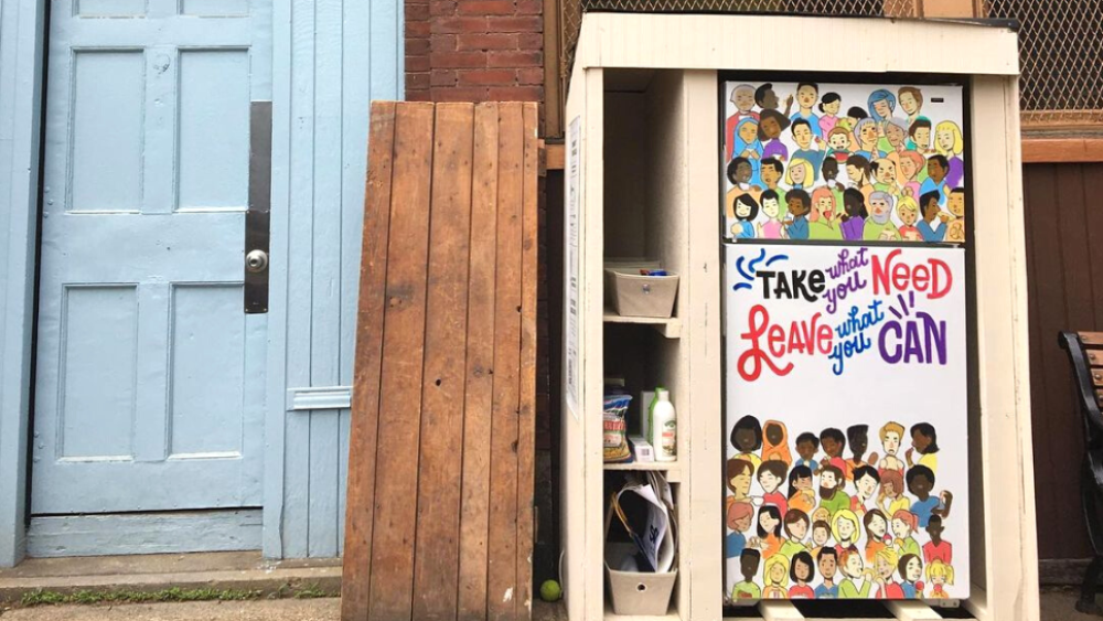 Outdoor fridge reads "Take what you need, leave what you can"