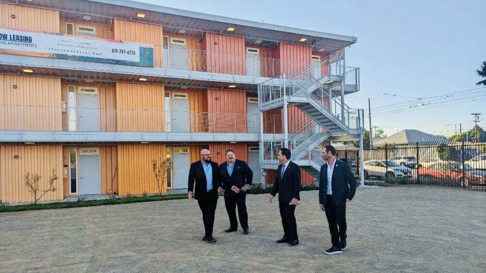 City leaders gather outside of the Monarch Artists Residence in Barrio Logan