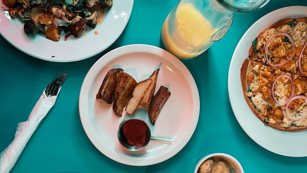 A birds-eye view of a table at Counter Culture, with several dishes on it