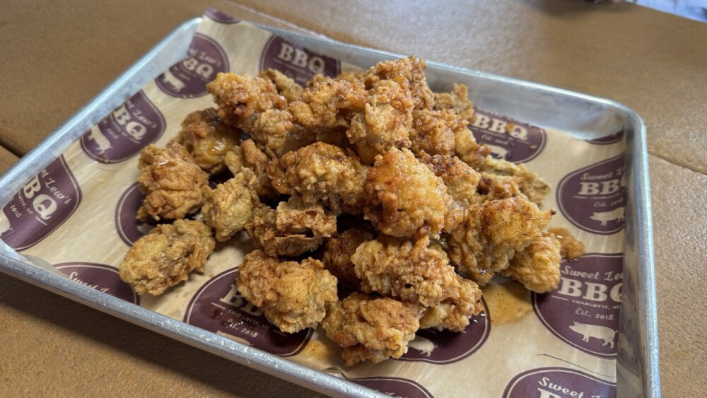A platter of a mound of fried oysters.